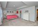 Expansive bedroom with a tray ceiling, carpeted floors and lots of natural light at 10209 Mamillion Dr, Huntersville, NC 28078