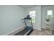 Functional exercise area with a treadmill and view from the window at 10209 Mamillion Dr, Huntersville, NC 28078