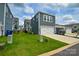Rear two-car garage with ample parking and lawn space in a modern neighborhood at 10209 Mamillion Dr, Huntersville, NC 28078