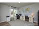 Bright home office with large windows, custom desks, and a world map accent wall at 10209 Mamillion Dr, Huntersville, NC 28078