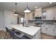 Stylish kitchen featuring an island with seating, stainless steel appliances, and pendant lighting at 10209 Mamillion Dr, Huntersville, NC 28078