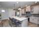 Modern kitchen with a spacious island, stainless steel appliances, and stylish pendant lighting at 10209 Mamillion Dr, Huntersville, NC 28078