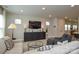 Spacious living room with plush sofas, a modern entertainment center, and recessed lighting at 10209 Mamillion Dr, Huntersville, NC 28078