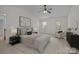 Bright bedroom with ceiling fan, neutral decor, and great natural light at 10600 Four Mile Creek Rd, Charlotte, NC 28277