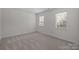Bedroom with neutral carpet and ample natural light from two bright windows at 10600 Four Mile Creek Rd, Charlotte, NC 28277