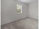 Bedroom featuring soft carpet and a bright window, ready for customization at 10600 Four Mile Creek Rd, Charlotte, NC 28277