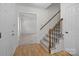Inviting home foyer with a staircase and hardwood floors, creating a warm and welcoming entrance at 10600 Four Mile Creek Rd, Charlotte, NC 28277