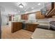 Functional kitchen layout with wood cabinets, modern appliances, and plenty of counter space for cooking at 10600 Four Mile Creek Rd, Charlotte, NC 28277
