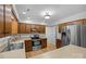 Spacious kitchen with stainless steel appliances, wood cabinetry, and an efficient layout for meal preparation at 10600 Four Mile Creek Rd, Charlotte, NC 28277
