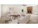 Bright living room with neutral furniture, brick fireplace, and natural light at 10600 Four Mile Creek Rd, Charlotte, NC 28277