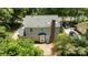 Aerial view of home featuring brick patio, backyard, and private driveway at 10600 Four Mile Creek Rd, Charlotte, NC 28277