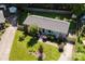 Aerial view of property featuring a well-manicured lawn and mature landscaping at 1114 Urban Pl, Charlotte, NC 28209