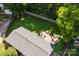 Aerial view of backyard featuring a stone patio and lush green lawn at 1114 Urban Pl, Charlotte, NC 28209