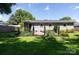Spacious backyard with well-maintained lawn and thoughtfully designed landscaping at 1114 Urban Pl, Charlotte, NC 28209