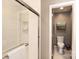 Bright bathroom showcasing a white-tiled shower and an open doorway to a toilet at 1114 Urban Pl, Charlotte, NC 28209