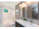 Bathroom featuring a double vanity with modern fixtures and a tiled shower/tub combination at 1114 Urban Pl, Charlotte, NC 28209