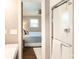 Bathroom with a glass shower door and a glimpse into the primary bedroom at 1114 Urban Pl, Charlotte, NC 28209
