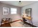 Cozy room with natural light, a wooden desk, chair and a decorative rug at 1114 Urban Pl, Charlotte, NC 28209