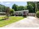 Charming single-story home with a well-maintained lawn and mature trees at 1114 Urban Pl, Charlotte, NC 28209