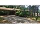 Exterior view of a brick home with a covered carport and a long driveway at 1116 Bryce Ave, Salisbury, NC 28144