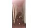 Dark and cluttered hallway with miscellaneous items strewn along the floor at 1116 Bryce Ave, Salisbury, NC 28144