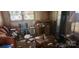 Cluttered living room featuring a sofa, desk, speakers, and miscellaneous items at 1116 Bryce Ave, Salisbury, NC 28144