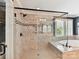 Modern bathroom with glass-enclosed shower, soaking tub, and elegant tile work at 1118 Yale Pl, Charlotte, NC 28209