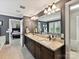 Luxurious bathroom features double vanity with granite counters, framed mirror, and opens to primary bedroom at 1118 Yale Pl, Charlotte, NC 28209