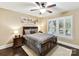 Comfortable bedroom with a ceiling fan, wood trim, and shuttered windows provides a relaxing retreat at 1118 Yale Pl, Charlotte, NC 28209