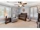 Charming Bedroom with plush carpet, ample natural light, and ceiling fan at 1118 Yale Pl, Charlotte, NC 28209