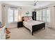 Bright bedroom features plantation shutters, plush carpet, and neutral decor at 1118 Yale Pl, Charlotte, NC 28209