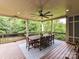 Inviting outdoor deck with ceiling fan, dining table, and scenic views, perfect for entertaining at 1118 Yale Pl, Charlotte, NC 28209