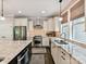A modern, spacious kitchen with stainless steel appliances, granite countertops, and white cabinets at 1118 Yale Pl, Charlotte, NC 28209