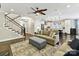 Spacious living room with stairs, open to kitchen, and neutral decor at 1118 Yale Pl, Charlotte, NC 28209