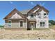 Unfinished two-story home with visible construction materials at 11555 Valley Oak Ln, Stanfield, NC 28163