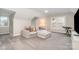 Bonus room featuring carpet floors, a couch, and abundant natural light from the windows at 12411 Herdon Ct, Charlotte, NC 28277