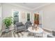 Cozy living room featuring modern furniture, natural light, and stylish decor at 12411 Herdon Ct, Charlotte, NC 28277