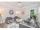 Elegant living room with comfortable seating, contemporary decor, and ample natural light at 12411 Herdon Ct, Charlotte, NC 28277
