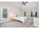 Main bedroom with large windows, vaulted ceiling, and cozy carpet, creating a serene retreat at 12411 Herdon Ct, Charlotte, NC 28277