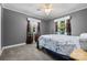 Bedroom showcasing carpet flooring, a ceiling fan, natural light and colorful curtains at 1252 Wendy Rd, Rock Hill, SC 29732