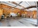 Spacious garage with exposed wood frame and a brick accent wall at 1252 Wendy Rd, Rock Hill, SC 29732