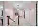 Upstairs hallway featuring neutral walls, carpet, decorative lighting and stairs to the lower level at 1252 Wendy Rd, Rock Hill, SC 29732