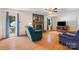 Bright living room with fireplace and view of the swimming pool through glass patio doors at 1252 Wendy Rd, Rock Hill, SC 29732