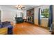 Cozy living room with a black tile fireplace, hardwood floors, and large windows at 1252 Wendy Rd, Rock Hill, SC 29732