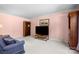 Cozy living room with carpet, featuring a large TV and bookcase at 1252 Wendy Rd, Rock Hill, SC 29732
