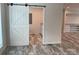 A barn door leading to a bathroom with nice tile floors, and modern finishes at 126 Zircon Dr, Statesville, NC 28625