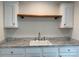 Bathroom sink featuring a faucet and a wood shelf above it at 126 Zircon Dr, Statesville, NC 28625