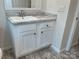 Bathroom featuring a single sink vanity with marble countertop and modern white cabinets at 126 Zircon Dr, Statesville, NC 28625