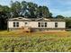 Charming single-story home with a classic design and inviting front porch at 126 Zircon Dr, Statesville, NC 28625