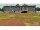 View of home's exterior featuring a wooden deck and gray siding at 126 Zircon Dr, Statesville, NC 28625